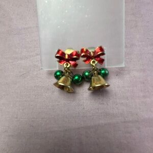 Festive Christmas Bell Earrings with clackers intact and red bows.